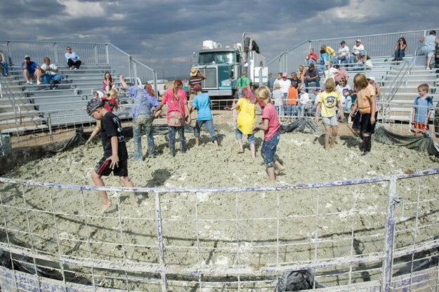 Mixing the mud. Photo by Tara Bolgiano, Blushing Crow Photography.