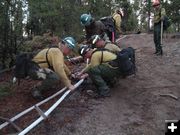 Laying sprinkler pipe. Photo by U.S. Forest Service.