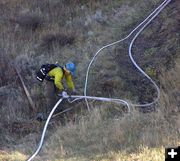 Checking the hoses. Photo by Dawn Ballou, Pinedale Online.