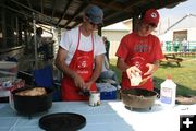Nathan and Austin cooking. Photo by Dawn Ballou, Pinedale Online.