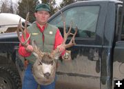 Brian Nesvik with poached deer. Photo by WGFD.