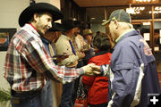 Signing autographs. Photo by Tim Ruland, Pinedale Fine Arts Council.