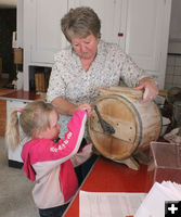 Churning butter. Photo by Clint Gilchrist, Pinedale Online.