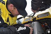 Blaine Fixes Throttle Cable. Photo by Terry Allen.