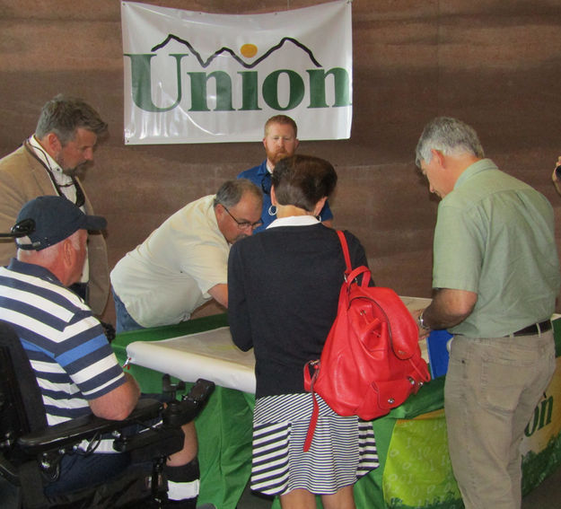 Looking at maps. Photo by Dawn Ballou, Pinedale Online.