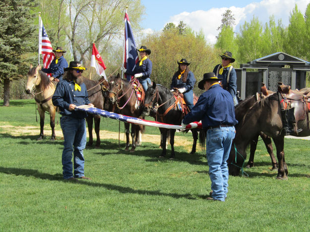 Flag folding. Photo by Dawn Ballou, Pinedale Online.