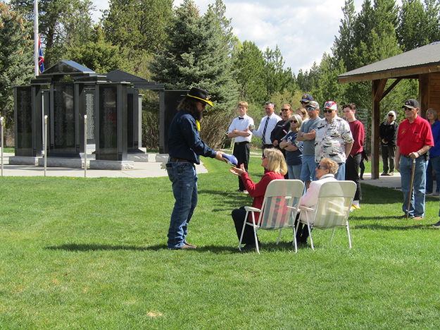 Presenting flag to wife Betty. Photo by Dawn Ballou, Pinedale Online.